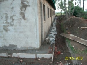 Concrete apron around the footer of the walls.