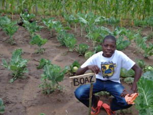 Boaz with his sukumawiki (like kale)