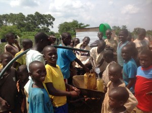 The instant that water was flowing (just out a hose) the community members filled containers for hours each day.