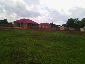 View from the back of the compound showing the Boys Dorm on the left with Girls House and other buildings to the right.