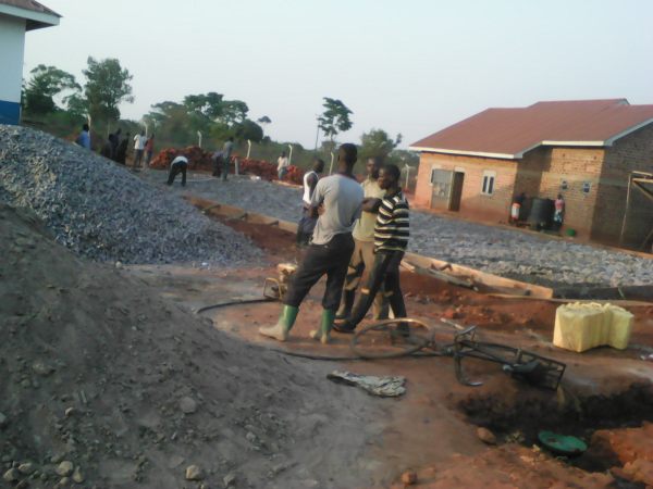 Framed in floor foundation of large rocks, small stones, and steel mesh. 