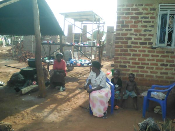 Old kitchen in the shadow of the new one.