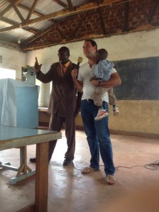 John giving his testimony at the Lyavo Bible Church with a friend.