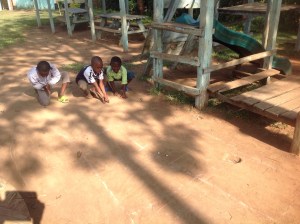 Boys playing marbles